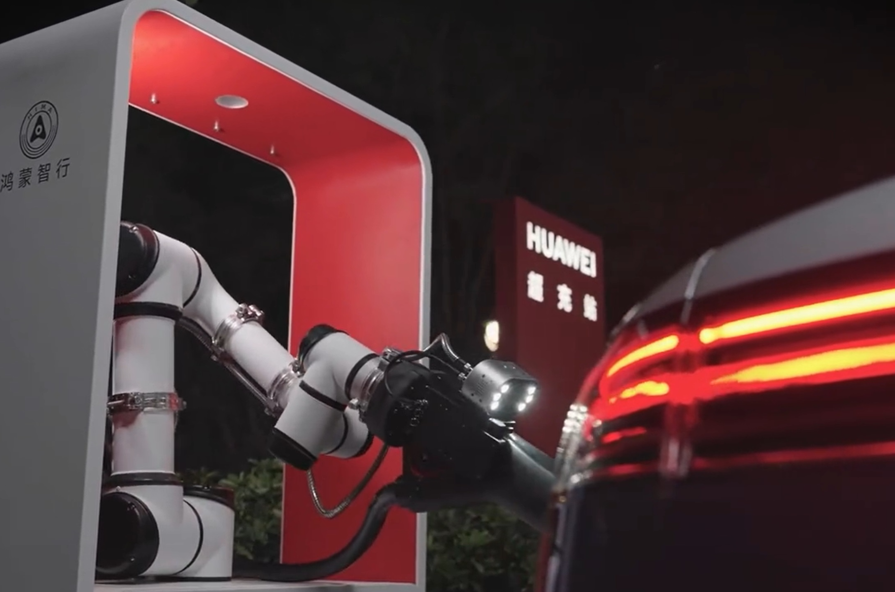 Watch Huawei’s robotic arm charge its own electric car