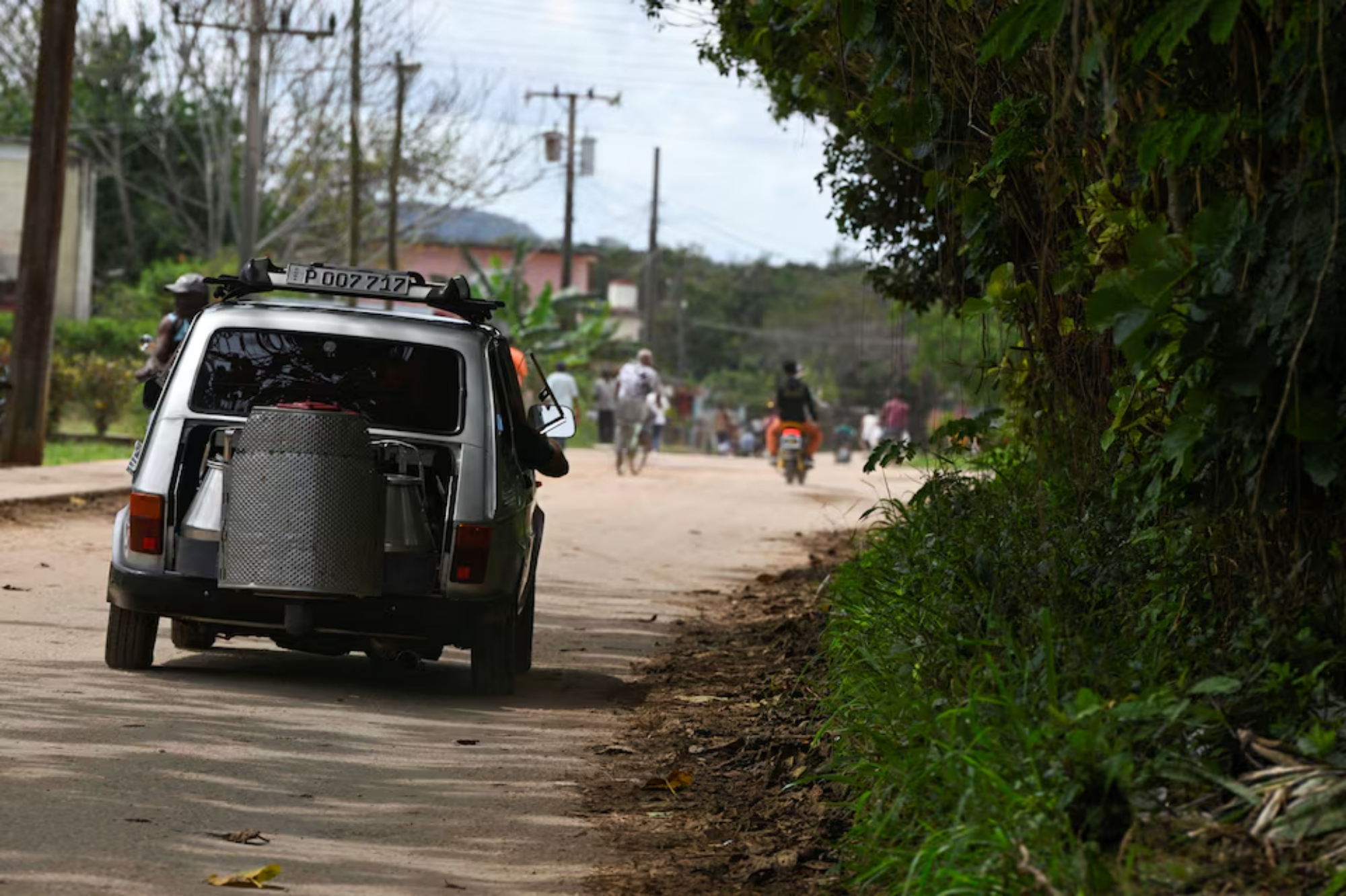 A Cuban man fuels his car with charcoal due to the US oil blockade.