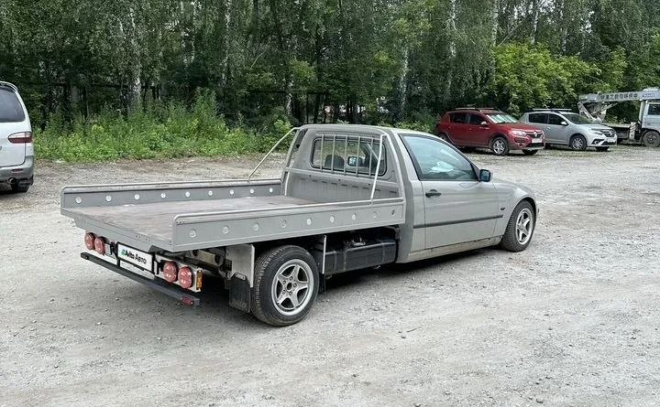 Russian craftsmen have made a pickup-tow truck out of a BMW 3 Series hatchback