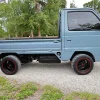 Tiny Honda Acty pickup truck with racing tires and sports steering wheel will be auctioned in the USA