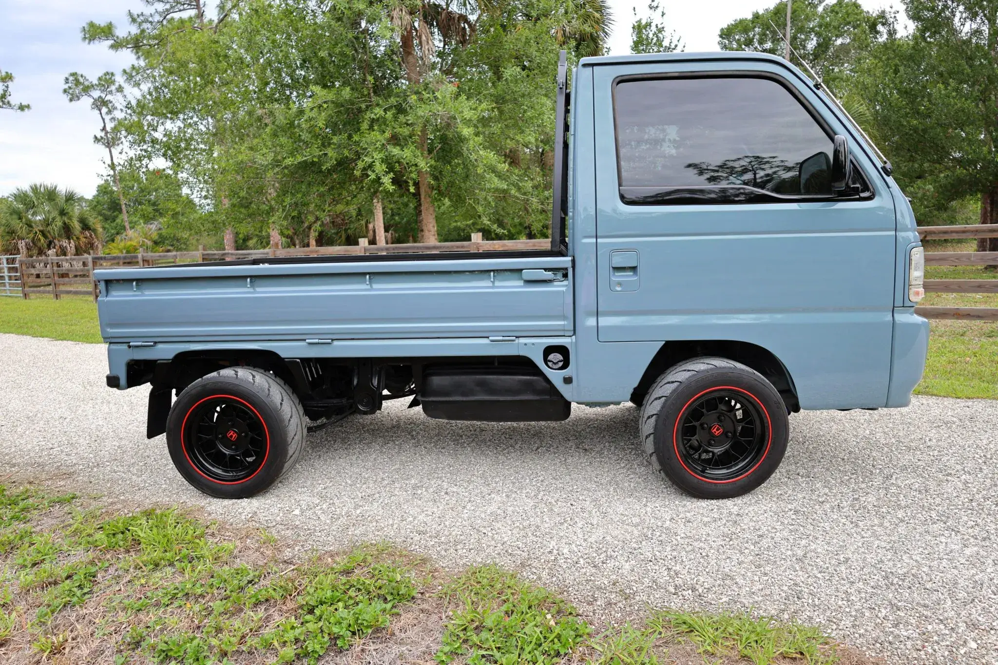 Tiny Honda Acty pickup truck with racing tires and sports steering wheel will be auctioned in the USA